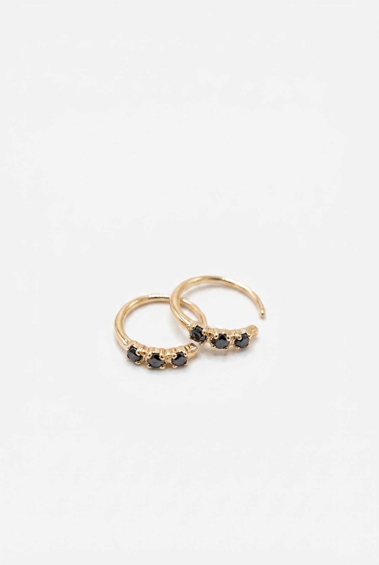 Black Diamond Huggie Earrings Gold