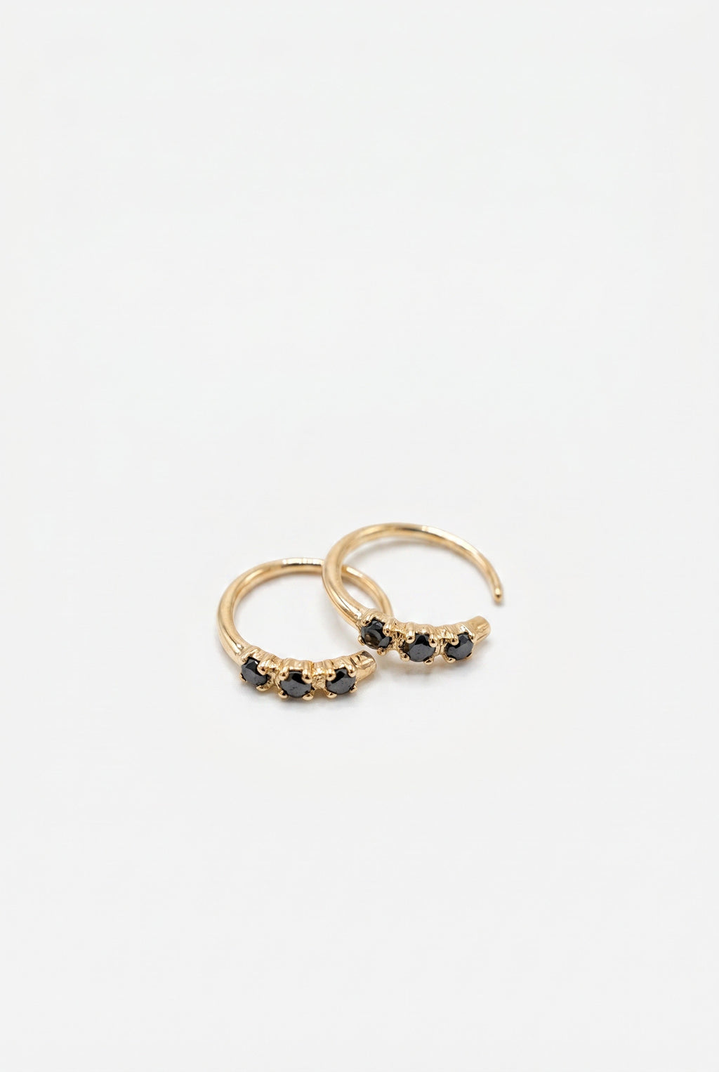 Black Diamond Huggie Earrings Gold
